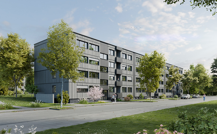 Modern apartment building with gray facade, surrounded by trees and greenery. A sidewalk and parked cars line the street under a partly cloudy sky.
